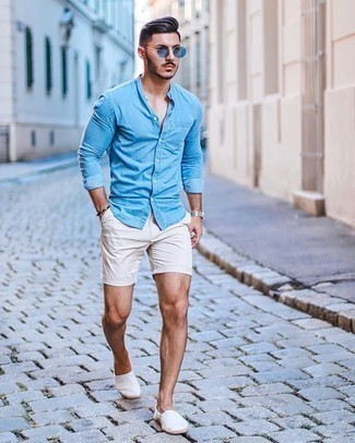 Blue Sunglasses Outfits For Men: For an on-trend menswear style without the need to sacrifice on functionality, we turn to this combination of a light blue chambray long sleeve shirt and blue sunglasses. White canvas espadrilles are guaranteed to bring an extra dose of style to your getup.