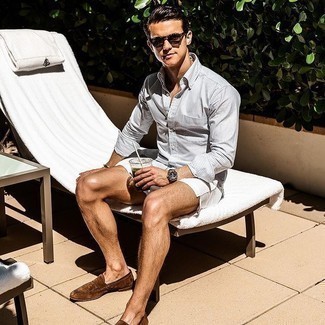 White Shorts Outfits For Men: A grey vertical striped long sleeve shirt looks so casually dapper when paired with white shorts. On the fence about how to finish your look? Rock a pair of dark brown suede loafers to turn up the classy factor.