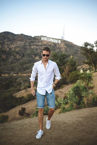 Light Blue Denim Shorts Outfits For Men: You'll be amazed at how easy it is for any gentleman to throw together this casual look. Just a white long sleeve shirt and light blue denim shorts. The whole look comes together really well when you add a pair of white low top sneakers to your ensemble.