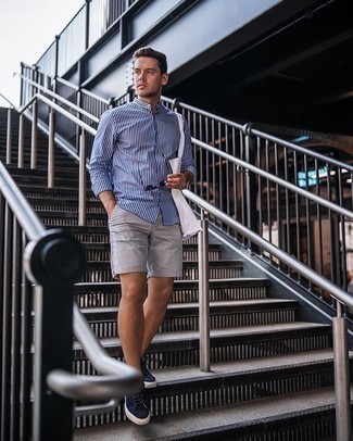 Men's White and Navy Vertical Striped Long Sleeve Shirt, Grey Shorts, Navy Suede Low Top Sneakers, Navy Canvas Tote Bag