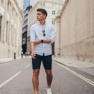 White Vertical Striped Long Sleeve Shirt Outfits For Men: This casual combo of a white vertical striped long sleeve shirt and navy shorts is extremely easy to put together in seconds time, helping you look amazing and prepared for anything without spending too much time rummaging through your wardrobe. A good pair of white canvas low top sneakers will never go out of style.