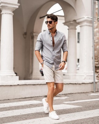 White Shorts Outfits For Men: Team a grey long sleeve shirt with white shorts to pull together an incredibly stylish and current laid-back ensemble. Complement your ensemble with a pair of white canvas low top sneakers and ta-da: this look is complete.