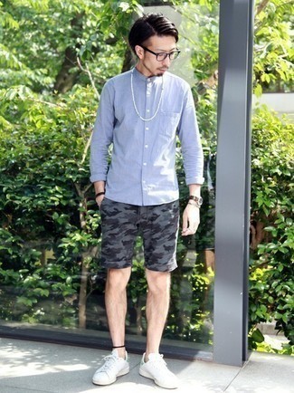 Grey Camouflage Shorts Outfits For Men: Infuse style into your current off-duty rotation with a light blue long sleeve shirt and grey camouflage shorts. Complete this outfit with a pair of white and green leather low top sneakers et voila, your look is complete.