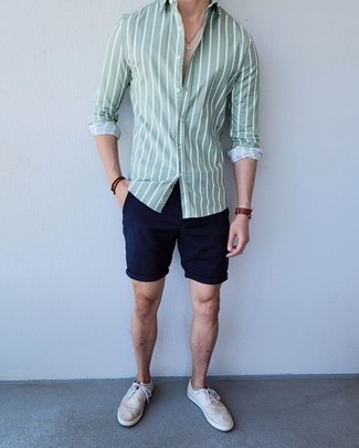 Mint Vertical Striped Long Sleeve Shirt Outfits For Men: If you're looking for a casual and at the same time seriously stylish getup, pair a mint vertical striped long sleeve shirt with navy shorts. When not sure as to what to wear in the shoe department, complete your ensemble with grey canvas low top sneakers.
