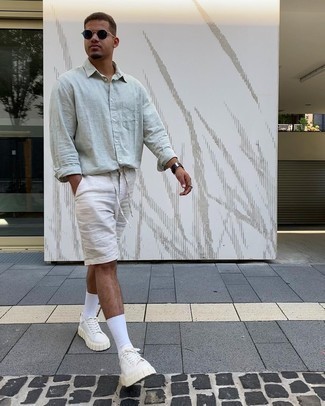 Mint Linen Long Sleeve Shirt Outfits For Men: Marry a mint linen long sleeve shirt with white linen shorts for a casual and fashionable ensemble. White canvas low top sneakers are a wonderful option to complement your look.