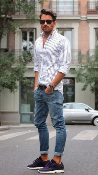 Violet Athletic Shoes with Blue Jeans Outfits For Men: If you're looking for a street style and at the same time stylish outfit, reach for a white and black vertical striped long sleeve shirt and blue jeans. Complement this ensemble with a pair of violet athletic shoes to make an all-too-safe ensemble feel suddenly fun and fresh.