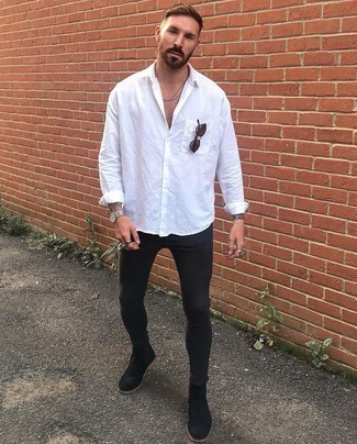 White Linen Long Sleeve Shirt Outfits For Men: This off-duty combination of a white linen long sleeve shirt and black skinny jeans is a goofproof option when you need to look dapper in a flash. And if you wish to effortlessly rev up this look with a pair of shoes, why not opt for charcoal suede chelsea boots?