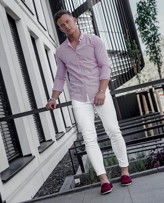 Purple Canvas Espadrilles Outfits For Men: We're all seeking comfort when it comes to fashion, and this edgy combination of a white and red vertical striped long sleeve shirt and white skinny jeans is a wonderful example of that. And if you wish to easily bump up your ensemble with a pair of shoes, add a pair of purple canvas espadrilles to the mix.