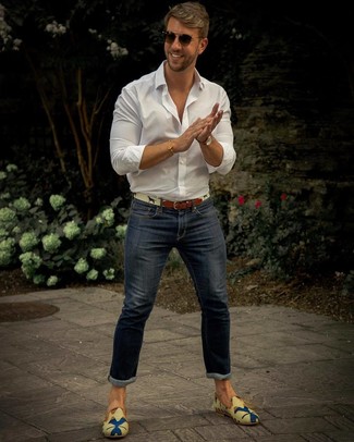 Navy Skinny Jeans Summer Outfits For Men: Consider pairing a white long sleeve shirt with navy skinny jeans if you wish to look casually dapper without much work. Give a more refined twist to your ensemble by slipping into multi colored print canvas loafers. You'll always look stylish even despite the sweltering heat if you have this look as a last-minute grab.