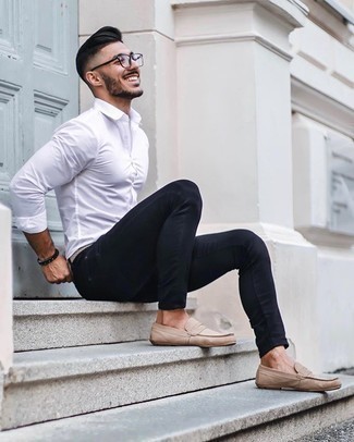 Beige Suede Loafers Outfits For Men: This look with a white long sleeve shirt and black skinny jeans isn't super hard to create and leaves room to more experimentation. Got bored with this look? Invite beige suede loafers to mix things up a bit.