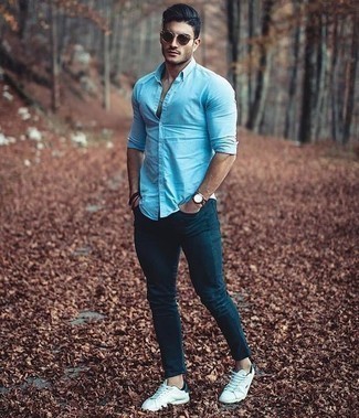 Men's Light Blue Long Sleeve Shirt, Teal Skinny Jeans, White and Black Canvas Low Top Sneakers, Dark Brown Sunglasses