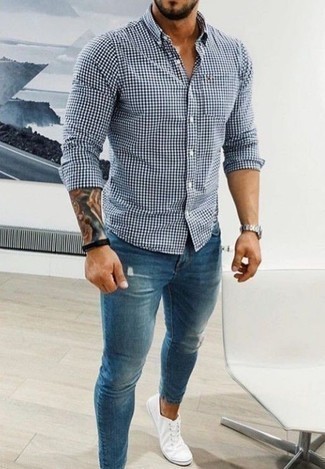 White and Navy Gingham Long Sleeve Shirt Outfits For Men: This urban combo of a white and navy gingham long sleeve shirt and blue ripped skinny jeans can only be described as ridiculously stylish. To bring some extra zing to your ensemble, go for white canvas low top sneakers.