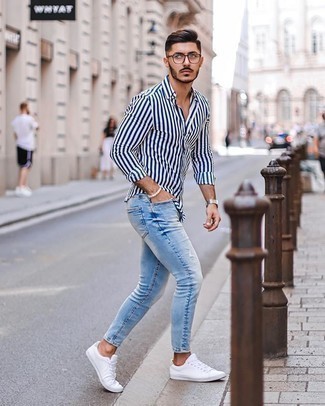 Men's White and Navy Vertical Striped Long Sleeve Shirt, Light Blue Ripped Skinny Jeans, White Canvas Low Top Sneakers, Clear Sunglasses