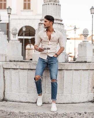 Grey Sunglasses Outfits For Men: You're looking at the hard proof that a tan vertical striped long sleeve shirt and grey sunglasses are awesome when combined together in a modern casual getup. Serve a little mix-and-match magic with a pair of white canvas low top sneakers.