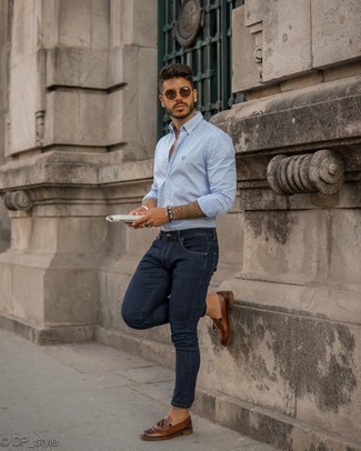 Navy Skinny Jeans Outfits For Men: Such items as a light blue vertical striped long sleeve shirt and navy skinny jeans are the perfect way to inject extra cool into your day-to-day styling arsenal. A pair of dark brown leather tassel loafers easily dials up the style factor of any outfit.
