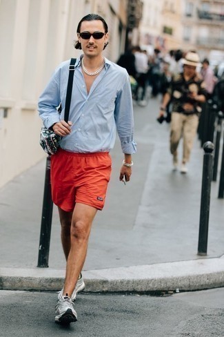Yellow Shorts Outfits For Men: This combo of a light blue long sleeve shirt and yellow shorts has this casual and approachable vibe. You can get a little creative in the footwear department and complete this look with grey athletic shoes.
