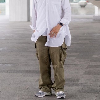 White Tank with Cargo Pants Warm Weather Outfits In Their 30s: For the style that looks as chill as it can get, go for a white tank and cargo pants. Look at how great this ensemble pairs with a pair of grey athletic shoes. Ideal to tell the world that you're mature enough and confident enough to own your fashion choices.