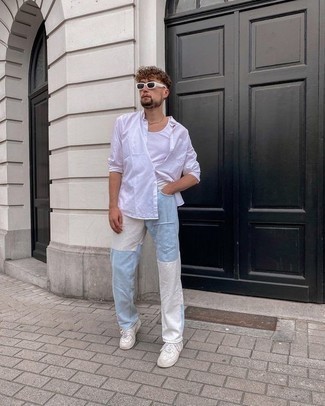 Light Blue Patchwork Jeans Outfits For Men: Demonstrate your credentials in men's fashion by putting together a white long sleeve shirt and light blue patchwork jeans for a laid-back getup. White leather low top sneakers pull the ensemble together.