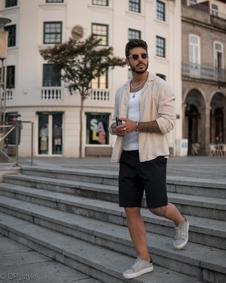 Grey Leather Low Top Sneakers Outfits For Men: This combo of a beige long sleeve shirt and black shorts is the perfect base for a countless number of combos. Add grey leather low top sneakers to the mix and off you go looking amazing.