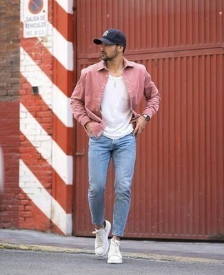 White Tank Outfits For Men: A white tank and light blue skinny jeans are the kind of a tested casual combo that you so terribly need when you have zero time. Complement this look with white canvas low top sneakers for an extra dose of style.