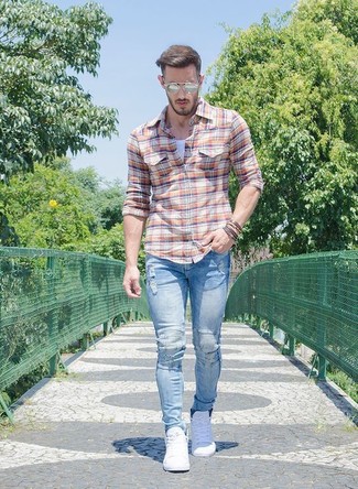 Light Blue Ripped Skinny Jeans Outfits For Men: This pairing of an orange plaid long sleeve shirt and light blue ripped skinny jeans brings comfort and confidence and helps you keep it low-key yet trendy. For something more on the classy end to finish this look, complement your look with white low top sneakers.