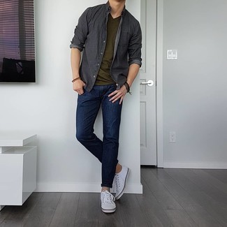 Olive V-neck T-shirt Outfits For Men: For a cool and casual ensemble, consider wearing an olive v-neck t-shirt and navy jeans — these pieces work pretty good together. Let your sartorial expertise really shine by complementing this look with a pair of white canvas low top sneakers.
