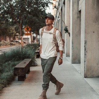Olive Baseball Cap Outfits For Men: A white long sleeve t-shirt and an olive baseball cap are must-have must-haves if you're piecing together an off-duty closet that matches up to the highest menswear standards. Perk up your getup by finishing with tan suede casual boots.
