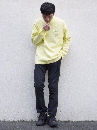 Yellow Long Sleeve T-Shirt Outfits For Men: A yellow long sleeve t-shirt and black chinos are absolute menswear must-haves if you're picking out an off-duty closet that matches up to the highest fashion standards. Play down your look by sporting black athletic shoes.