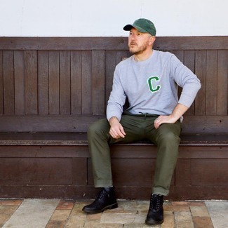 Dark Green Baseball Cap Outfits For Men: A grey embroidered long sleeve t-shirt and a dark green baseball cap matched together are a good match. If you need to easily lift up this look with a pair of shoes, why not throw black leather casual boots in the mix?