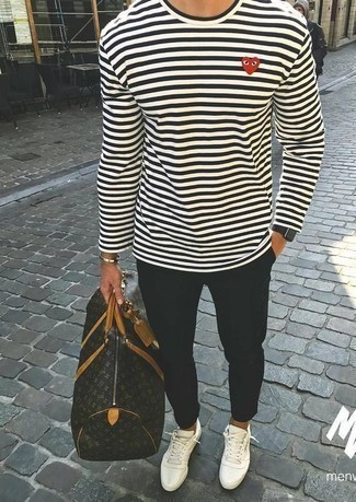 White and Black Horizontal Striped Long Sleeve T-Shirt Outfits For Men: Wear a white and black horizontal striped long sleeve t-shirt and black chinos if you want to look casually dapper without too much work. Now all you need is a good pair of white canvas low top sneakers to finish off this ensemble.