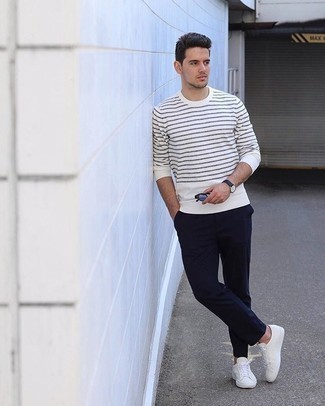 Men's White and Black Horizontal Striped Long Sleeve T-Shirt, Navy Chinos, Beige Canvas Low Top Sneakers, Black Sunglasses