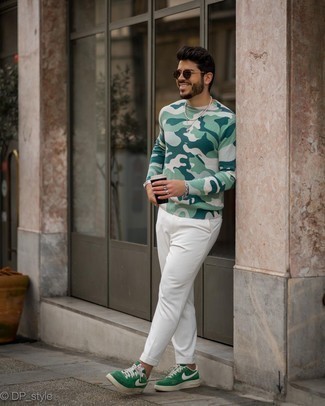 White Chinos Outfits: Why not go for a green print long sleeve t-shirt and white chinos? Both of these pieces are super practical and look nice paired together. Now all you need is a great pair of green canvas low top sneakers.