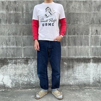 White and Black Print Crew-neck T-shirt Outfits For Men: If you feel more confident wearing something functional, you'll like this edgy pairing of a white and black print crew-neck t-shirt and navy jeans. A pair of beige suede sandals easily steps up the street cred of your outfit.