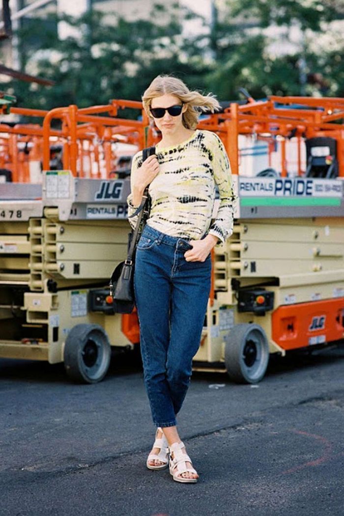 Women's Yellow Tie-Dye Long Sleeve T-shirt, Navy Jeans, White Leather Flat  Sandals, Black Leather Crossbody Bag