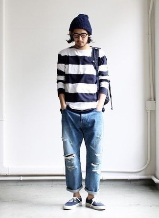 Blue Canvas Low Top Sneakers Outfits For Men: Why not pair a white and navy horizontal striped long sleeve t-shirt with light blue ripped jeans? These two items are very functional and look cool matched together. Blue canvas low top sneakers will immediately lift up even your most comfortable clothes.