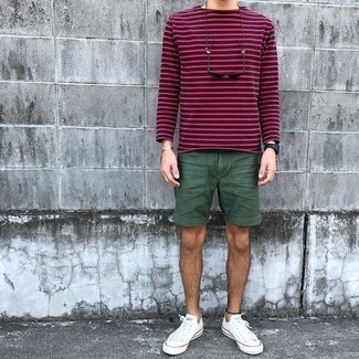 Navy Horizontal Striped Long Sleeve T-Shirt Outfits For Men: To create a relaxed casual look with a modernized spin, you can wear a navy horizontal striped long sleeve t-shirt and dark green shorts. Let your styling savvy really shine by completing your outfit with a pair of white canvas low top sneakers.