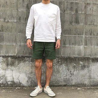 Teal Shorts Outfits For Men: This pairing of a white long sleeve t-shirt and teal shorts is very easy to throw together and so comfortable to sport from dawn till dusk as well! Let your sartorial credentials really shine by finishing your look with a pair of white canvas low top sneakers.