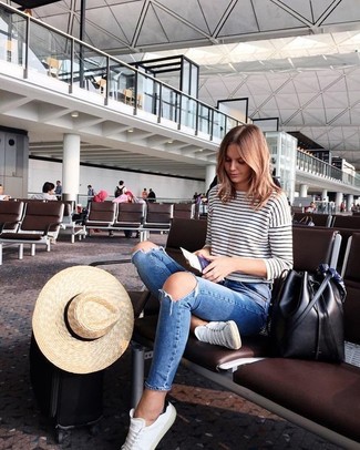 White and Black Long Sleeve T-shirt Outfits For Women: A white and black long sleeve t-shirt and blue ripped skinny jeans are essential casual items, without which our closets would surely be incomplete. Look at how great this look pairs with white canvas low top sneakers.