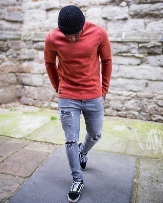 Charcoal Ripped Jeans Outfits For Men: Why not make a red long sleeve t-shirt and charcoal ripped jeans your outfit choice? As well as totally practical, these pieces look awesome when paired together. Why not take a classic approach with shoes and complete your look with a pair of black and white canvas low top sneakers?