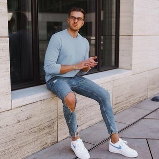 Blue Ripped Skinny Jeans Outfits For Men: A light blue long sleeve t-shirt and blue ripped skinny jeans are a smart pairing to add to your current casual fashion mix. White and blue canvas low top sneakers will bring an extra touch of elegance to an otherwise everyday look.