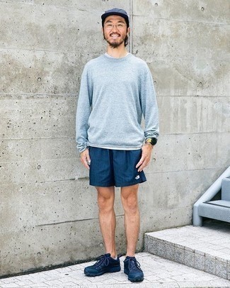 Men's Outfits 2023: If you like street style style, why not take this combination of a light blue long sleeve t-shirt and navy sports shorts for a spin? The whole outfit comes together really well if you add a pair of navy athletic shoes to your look.