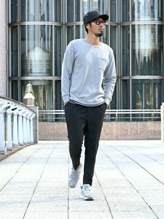Grey Long Sleeve T-Shirt Outfits For Men: Want to infuse your menswear arsenal with some effortless cool? Pair a grey long sleeve t-shirt with black chinos. Unimpressed with this getup? Invite a pair of grey athletic shoes to change things up a bit.