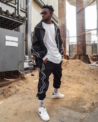 Men's White Long Sleeve T-Shirt, Black Track Suit, White and Black Leather Low Top Sneakers, Dark Brown Sunglasses