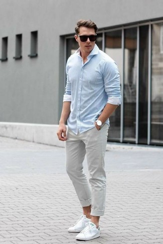 Men's Black Sunglasses, White Leather Low Top Sneakers, Grey Chinos, Light Blue Vertical Striped Long Sleeve Shirt