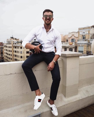 Men's Brown Sunglasses, White Print Leather Low Top Sneakers, Black Vertical Striped Chinos, White Long Sleeve Shirt