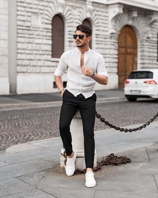 Men's Dark Brown Sunglasses, White Canvas Low Top Sneakers, Black Chinos, White Vertical Striped Long Sleeve Shirt