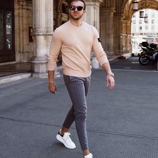 Men's Dark Brown Sunglasses, White and Black Leather Low Top Sneakers, Blue Vertical Striped Chinos, Beige Long Sleeve T-Shirt