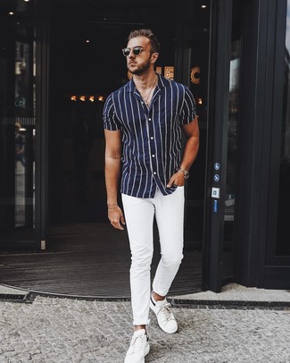 Men's Black Sunglasses, White Leather Low Top Sneakers, White Chinos, Navy and White Vertical Striped Short Sleeve Shirt