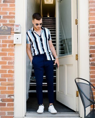 Men's Dark Brown Sunglasses, White and Navy Leather Low Top Sneakers, Navy Chinos, White and Navy Vertical Striped Short Sleeve Shirt