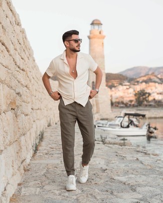Men's Dark Brown Sunglasses, White Leather Low Top Sneakers, Olive Chinos, Beige Short Sleeve Shirt
